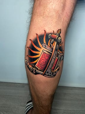 Neo-Traditional Coil Tattoo Machine in Vibrant Colors - Sacramento color tattoo of a coil tattoo machine with bold outlines and vibrant hues, created by a Sacramento tattoo artist