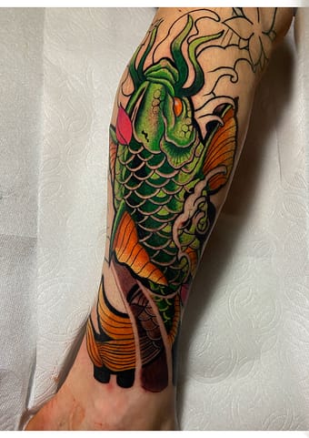 Neo-Traditional Japanese Koi Fish - Vibrant Color Tattoo in Sacramento Neo-Traditional Japanese koi fish tattoo with vibrant colors, created in Sacramento.